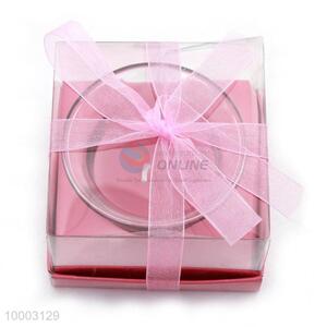 Pink candle with <em>glass</em> <em>cup</em>