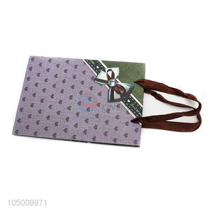 Factory directly sell delicate printed paper gift bag with handle