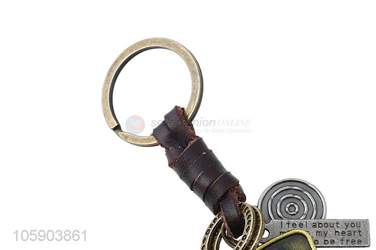 Wholesale new weave leather key chain with retro shield charms