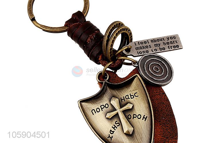 Wholesale cheap weave leather key chain with retro shield charms