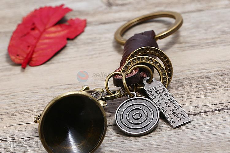 Bottom price weave leather key chain with retro alloy charms