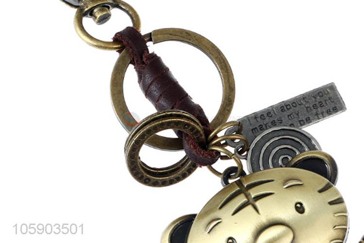 Wholesale cheap weave leather key chain with retro tiger charms