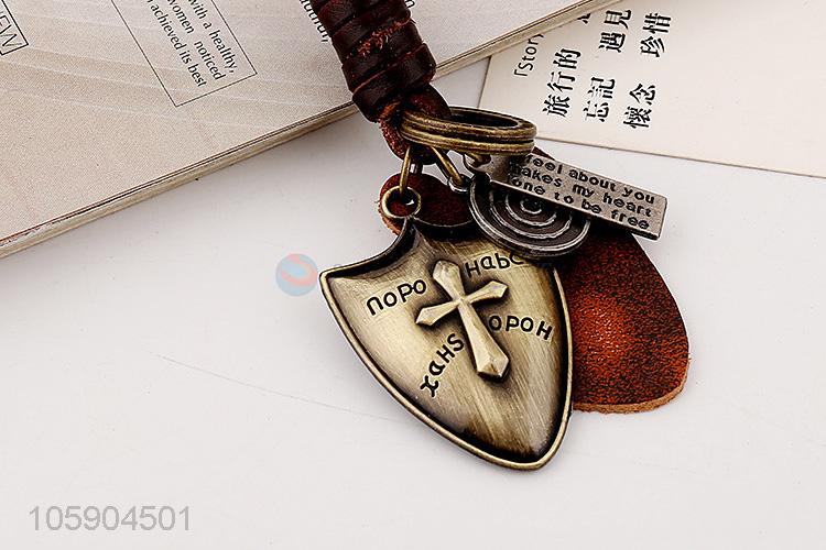 Wholesale cheap weave leather key chain with retro shield charms