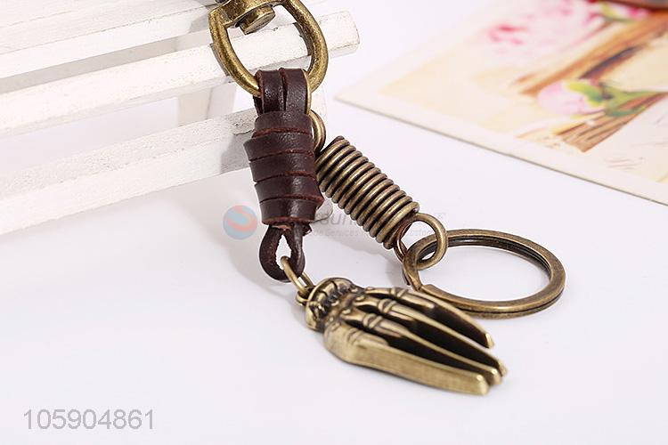 Wholesale new weave leather key chain with retro hand bone charms