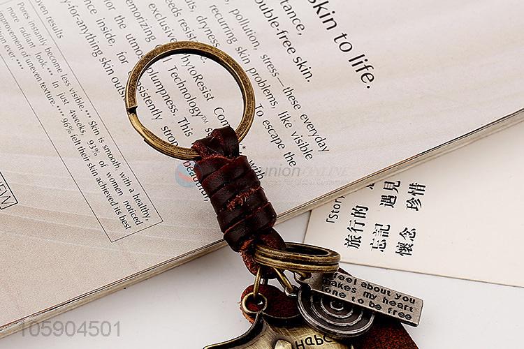 Wholesale cheap weave leather key chain with retro shield charms