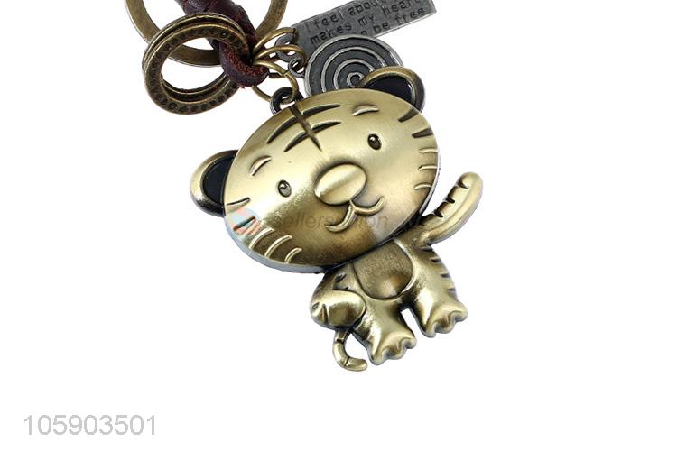 Wholesale cheap weave leather key chain with retro tiger charms