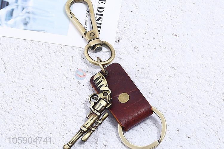 Factory wholesale leather key chain with retro pistol charms