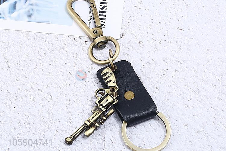 Factory wholesale leather key chain with retro pistol charms