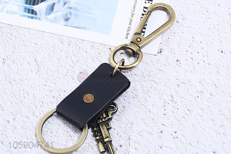 Factory wholesale leather key chain with retro pistol charms