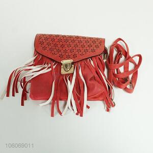 Hot selling laser cut pu messenger bag with tassels