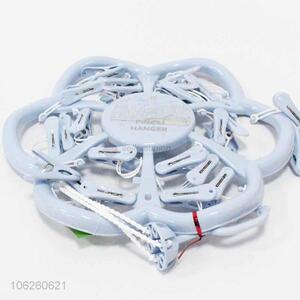 Low price flower shape plastic clothes hanger with clips