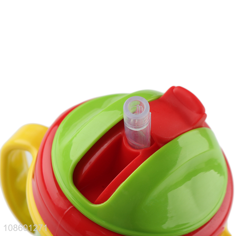 Wholesale food grade plastic baby training cup with straw and handles