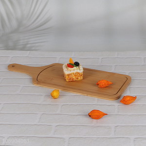 Hot selling multipurpose bamboo pizza <em>plate</em> cutting board with handle